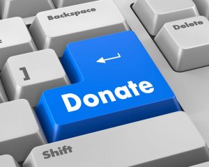 41630300 - donate button on computer keyboard pc key 3d